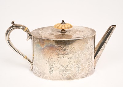 Lot 425 - Victorian silver tea pot of oval form, with bright cut decoration. flush fitting hinged cover with ivory finial, straight spout and silver handle, with ivory insulators (Birmingham 1889) Elkingt...