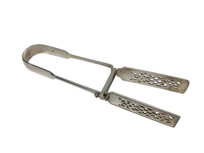 Lot 426 - Pair Victorian silver asparagus tongs, with pierced decoration (London1882) Holland Son & Slater. All at approximately 7ozs. 25cm overall length.
