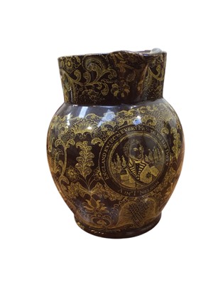 Lot 5161 - 19th century 'Portobello' jug commemorating Trafalgar, it bears a yellow transfer portrait of Nelson on a brown background