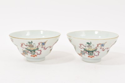 Lot 315 - Good pair of Chinese famille rose bowls, late 19th / early 20th century of ogee form, decorated with precious objects, four-character mark to base, 11.25cm diameter