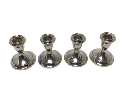 Lot 431 - Set of four contemporary silver dwarf candlesticks, (Birmingham 1982), maker Alan M. Weisrose, each 7.6cm in overall height.