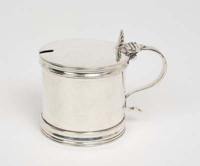Lot 437 - George V silver mustard pot of drum form, with hinged cover, shell shaped thumb piece, scroll handle and blue glass liner to interior, (Sheffield 1912), maker Cooper Brothers, 7.6cm in height, a...