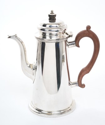 Lot 440 - George VI silver coffee pot of tapering form, with domed hinged cover and wooden scroll handle, raised on a circular foot, (Sheffield 1936), maker Atkin Brothers, 22cm overall height, all at 20o...