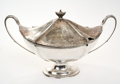 Lot 442 - Impressive Edwardian silver tureen and cover of oval form with twin scroll handles, reeded border and removable cover, raised on an oval pedestal foot, (London 1906), Thomas Bradbury & Sons,...