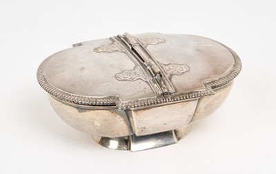 Lot 447 - Edwardian silver trinket box of oval form, with gadrooned border and twin hinged lids, raised on a oval foot, (London 1908), maker Wakely & Wheeler, 14.2cm in length, all at 10.5ozs.