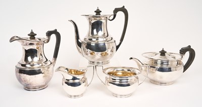 Lot 465 - 1920s Elkington & Co five piece tea and coffee set, comprising teapot of compressed baluster form, with flared reeded border, hinged cover and ebony handle, on a circular foot, matching coff...
