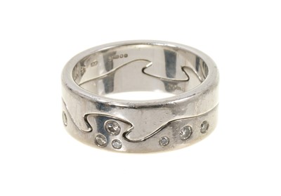Lot 705 - Georg Jensen 'Fusion' 18ct white gold and diamond ring with two interlocking bands, maker's marks, London hallmarks 2007. Ring size approximately P