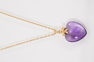 Lot 716 - Amethyst heart shaped pendant suspended from a gold mount on 18ct gold chain