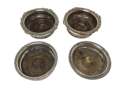Lot 450 - Pair of 19th century Old Sheffield plate wine coasters with gadrooned borders, together with a similar pair, (4).