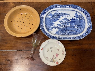 Lot 5187 - Fine Murano glass goblet, probably Salviati, together with an 18th century Chelsea plate, a rustic pottery slipware strainer, and a blue and white meat plate (4)