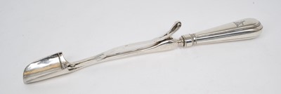 Lot 472 - George III silver Stilton scoop, with hinged slide action and engraved armorial crest, (London 1802), maker AK, 26cm overall length.