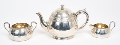 Lot 476 - Victorian silver three piece bachelor's teaset, comprising teapot of baluster form with engraved decoration and armorial, domed hinged lid and loop handle with ivory insulators, together with mat...