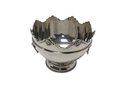Lot 483 - George VI silver Montieth of circular form, with scroll and cherub border and lion mask ring handles