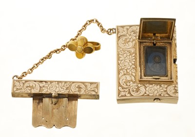Lot 745 - Early Victorian gold and black enamel pendant / clasp with concealed locket compartment, the hinged black enamel panel operated by a secret push button, the locket containing a hidden portrait of...