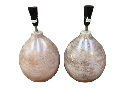 Lot 5235 - A pair of ceramic lamps together with a wooden sculpture and a wicker basket with lid