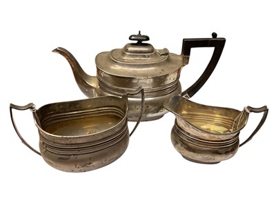 Lot 102 - Late Victorian silver three piece teaset comprising teapot of cauldron form with band of reeded decoration, domed hinged cover and angular Ebonised wood handle, together with matching milk jug a...