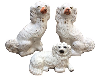 Lot 5210 - A pair of Staffordshire Spaniels together with one other