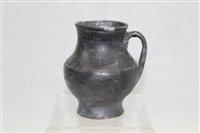 Lot 3735 - Roman pottery jug of baluster form, with strap...