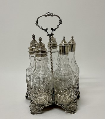 Lot 194 - Silver cruet set with five associated cut glass bottles