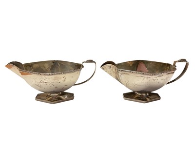 Lot 168 - Pair of George VI silver sauce boats of hexagonal form, each with engraved dates, (Birmingham 1947), each 14cm in length, all at approximately 7ozs.