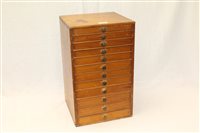 Lot 3753 - Small twelve-drawer wooden chest containing...