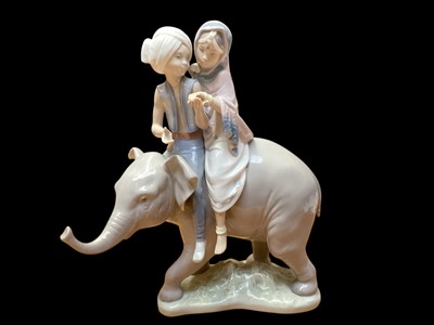 Lot 2215 - Lladro porcelain figure group - Hindu children riding on an elephant, 23cm high