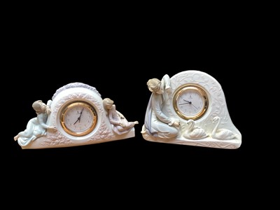 Lot 2216 - Two Lladro porcelain clocks, 19cm and 16.5cm high