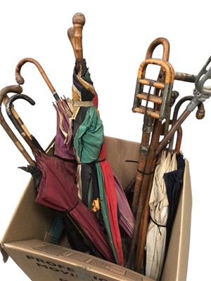 Lot 2552 - Collection of sticks and umbrellas, one with gold mount and two with yellow metal mounts.