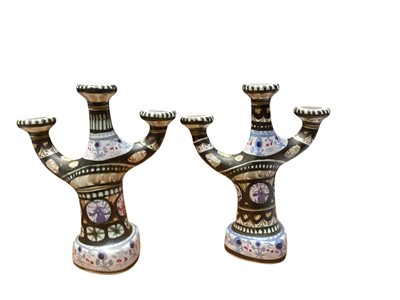 Lot 2234 - Pair of Quimper pottery three branch candelabra, 31.5cm high
