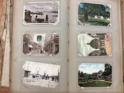 Lot 1262 - Postcards two large albums plus loose worldwide selection including used Japanese cards. American cowboys and girls, strong in Europe, mostly Edwardian (Qty)
