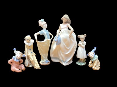 Lot 2236 - Lladro porcelain figure of a girl holding flowers, together with five Nao figures (6)