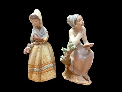 Lot 2243 - Two Lladro figures - Fiesta Spanish Woman Holding Roses, 34.5cm high and Poetic Moment, 32cm high
