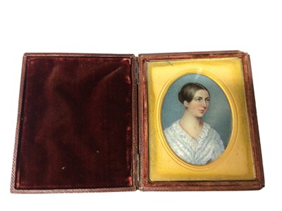 Lot 2977 - Early 19th century hand-painted miniature on ivory of a young lady, in a folding case