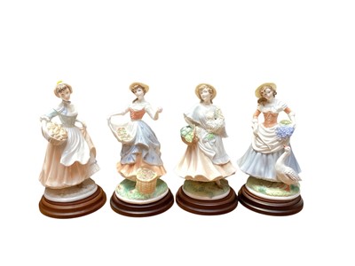 Lot 2263 - Four Royal Worcester limited edition figures - Fruit Picking, Baker's Wife, Goose Girl and Market Day, all of plinth bases and with certificates, together with a Royal Doulton jar and cover (5)<...