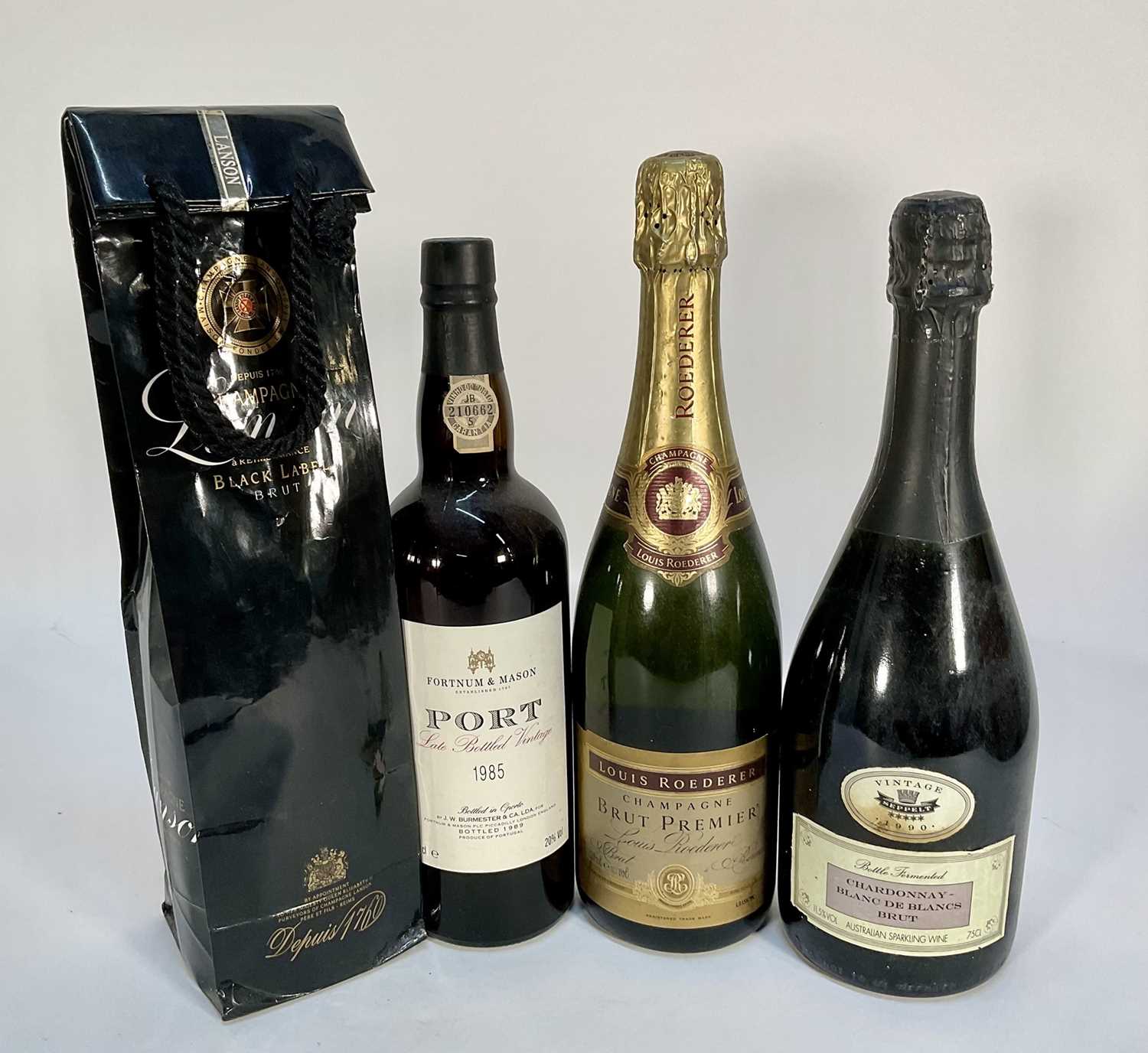 Lot 7 - Four bottles comprising: Fortnum & Mason LBV 1985 Port, Louis Roederer Champagne, Lanson Black Label and Chardonnnay Blanc De Blancs Brut (4)