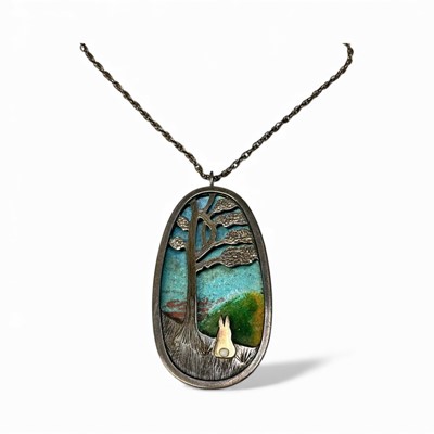 Lot 58 - Anthony Panton Hawksley (1921-1991), contemporary silver and enamel oval pendant, with pierced silver decoration depicting a rabbit sat beneath a tree on enamel ground, (London 1976), 6cm x 3cm...