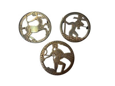 Lot 67 - Three 1930s silver circular brooches depicting a centaur, St. Christopher and a woman carrying a sheaf of wheat by Henry George Murphy, all bearing the Falcon studio mark, 32mm diameter