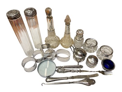 Lot 178 - Group of miscellaneous silver items to include silver mounted cut glass scent bottles, silver napkin rings and silver handled magnifying glass, (various dates and makers), together with some sil...