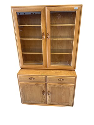 Lot 5373 - Ercol elm display cabinet