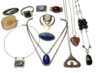 Lot 79 - Group of silver and white metal mounted semi-precious gemstone jewellery including a moss agate brooch (Sheffield 1991), lapis lazuli torque necklace and brooch, Art Nouveau blue pottery panel b...