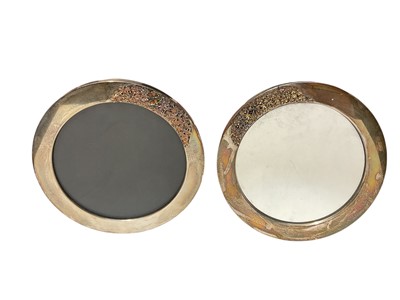 Lot 85 - Pair of silver mounted circular frames with floral decoration