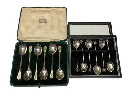 Lot 86 - Set of six 1930s silver coffee spoons with enamelled thistle decoration (Birmingham 1933) in a fitted Harrods box, together with another set of six 'sterling' spoons with pearl decoration