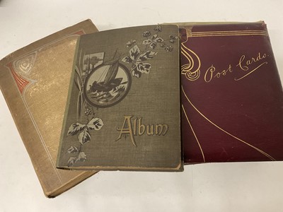 Lot 1118 - Three albums of postcards