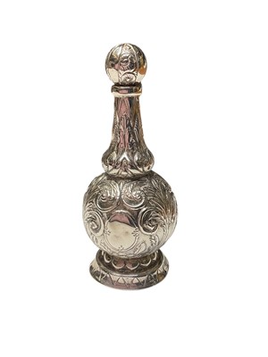 Lot 94 - Victorian silver scent bottle with embossed floral scroll decoration and stopper with chain (Birmingham 1884), maker R.W & Co. 7.5cm