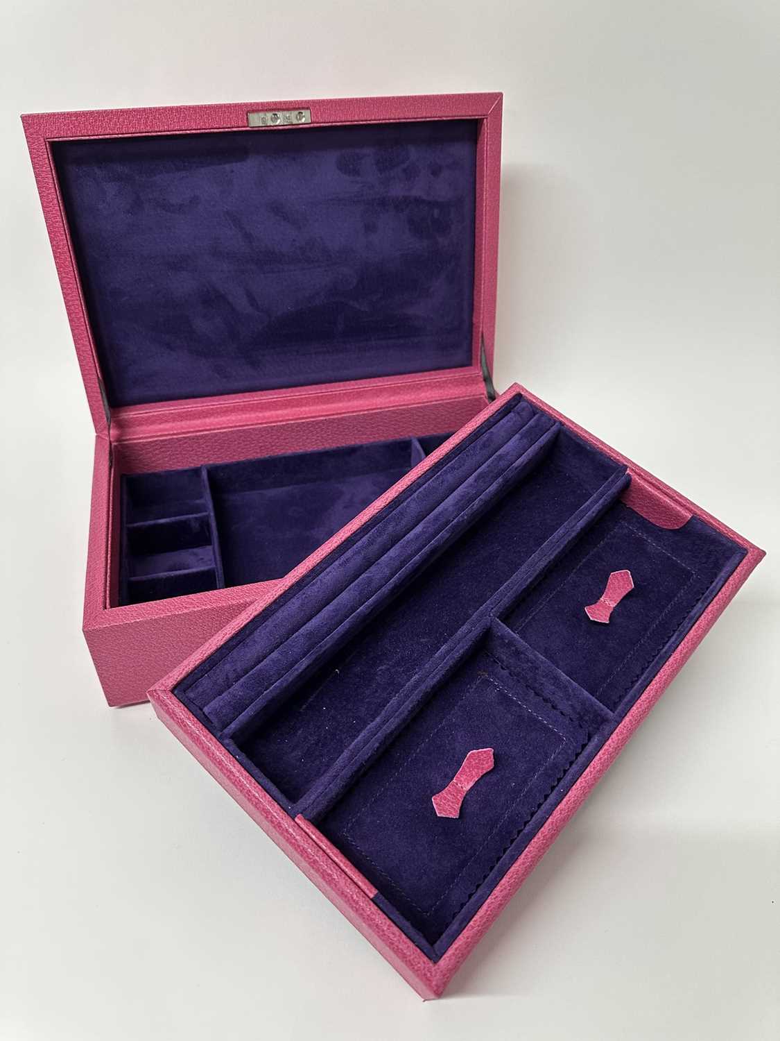 Lot 103 - Good quality Pickett pink leather jewellery case with two tier fitted interior, 29.5cm x 19.5cm