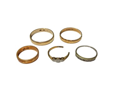 Lot 327 - Two gold wedding rings, both marked '585, 14K', together with 9ct gold wedding ring, 9ct gold half eternity ring and a broken ring (5)