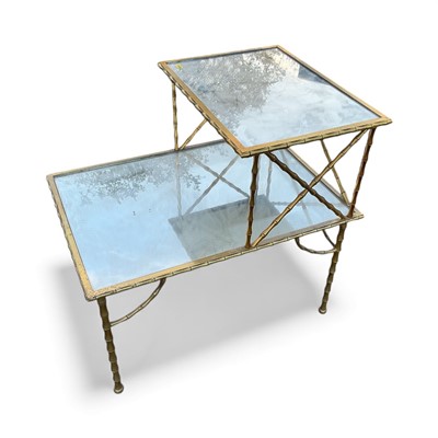 Lot 5376 - Mid 20th century brass two tier bedside table with inset mirrored glass panels and faux bamboo decoration, 61cm in height