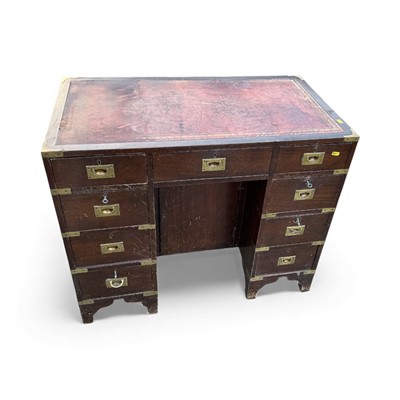 Lot 5365 - Mid - late 20th century mahogany campaign style kneehole writing desk with brass fittings and inset leather top, 66cm in height, 91cm in length and 51cm in depth.