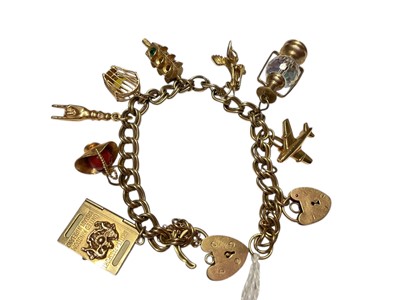 Lot 296 - 9ct gold charm bracelet with various gold and yellow metal charms