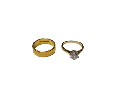 Lot 298 - 22ct gold wedding ring and a 14ct gold synthetic single stone dress ring (2)